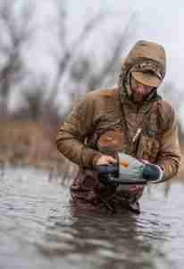 man placing motion duck decoy