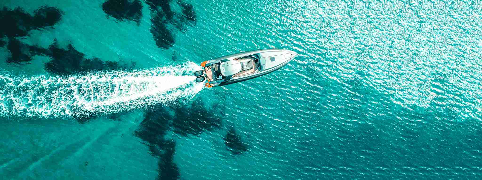 fishing boat speeding through the water