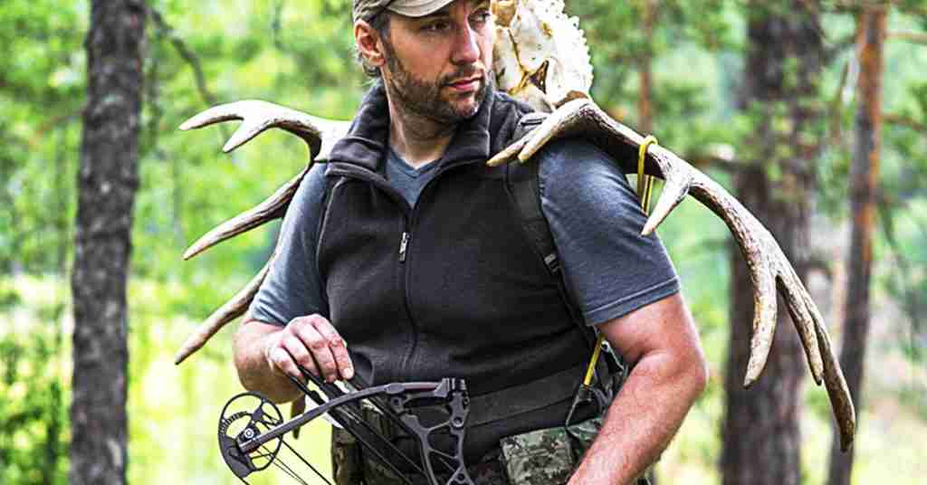Man with bow and deer antlers