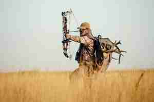Man hunting with compound bow